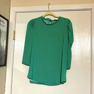 Green and white polka dot blouse